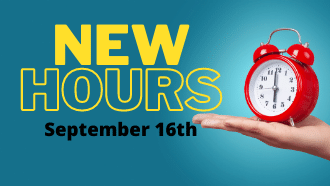 teal background with old red alarm clock yellow font